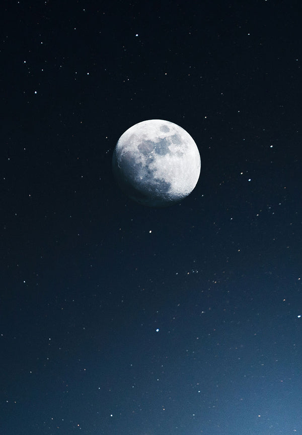 Waning Moon In Blue Sky